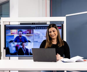 An Associate having a video call with other Associates